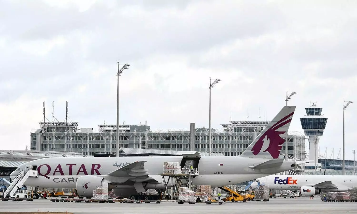 Cargo loading onto a Boeing 777F operated by Qatar Airways Cargo at Munich Airport