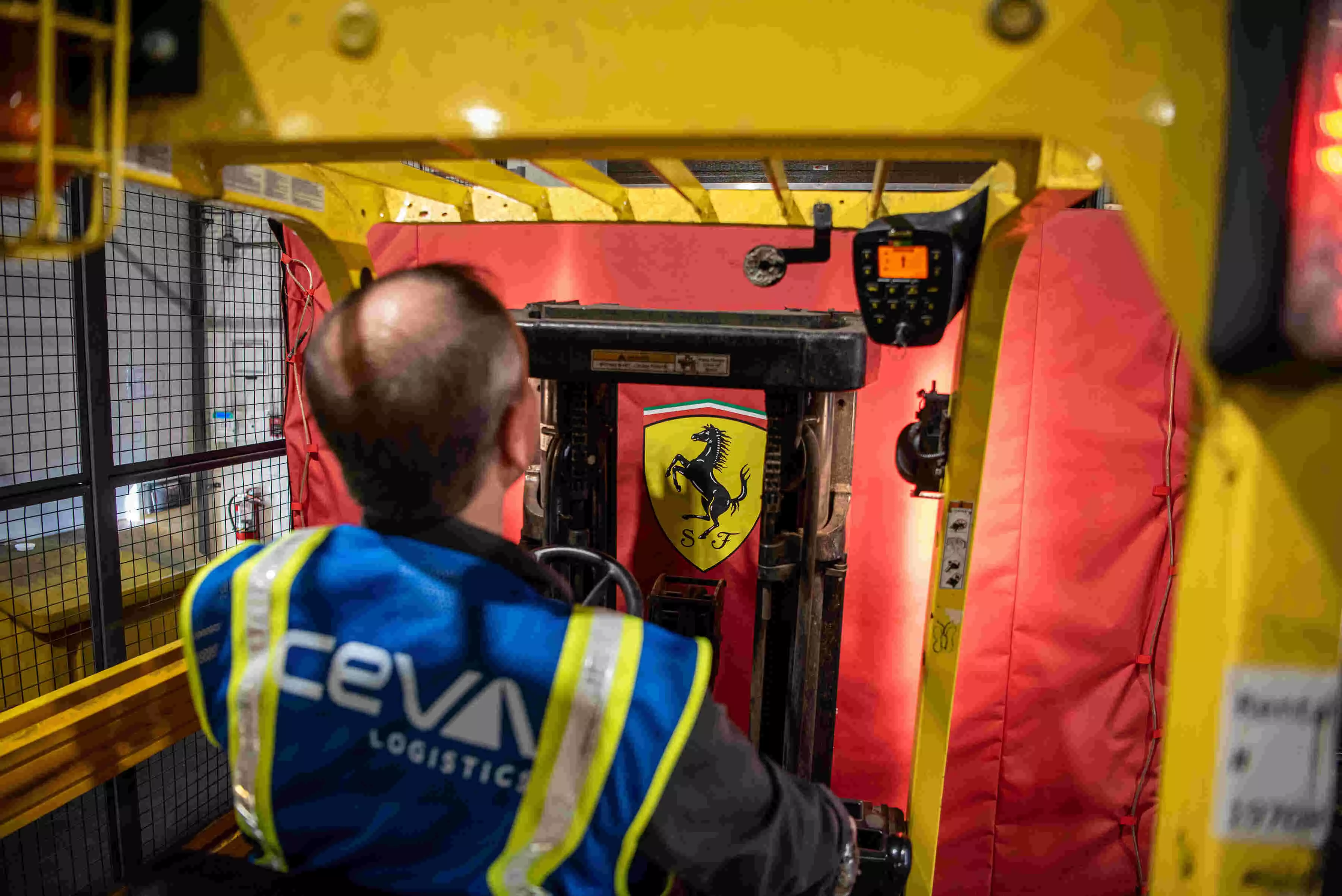 Inside CEVA’s warehouse, Ferrari’s precious cargo is carefully maneuvered for secure transport.