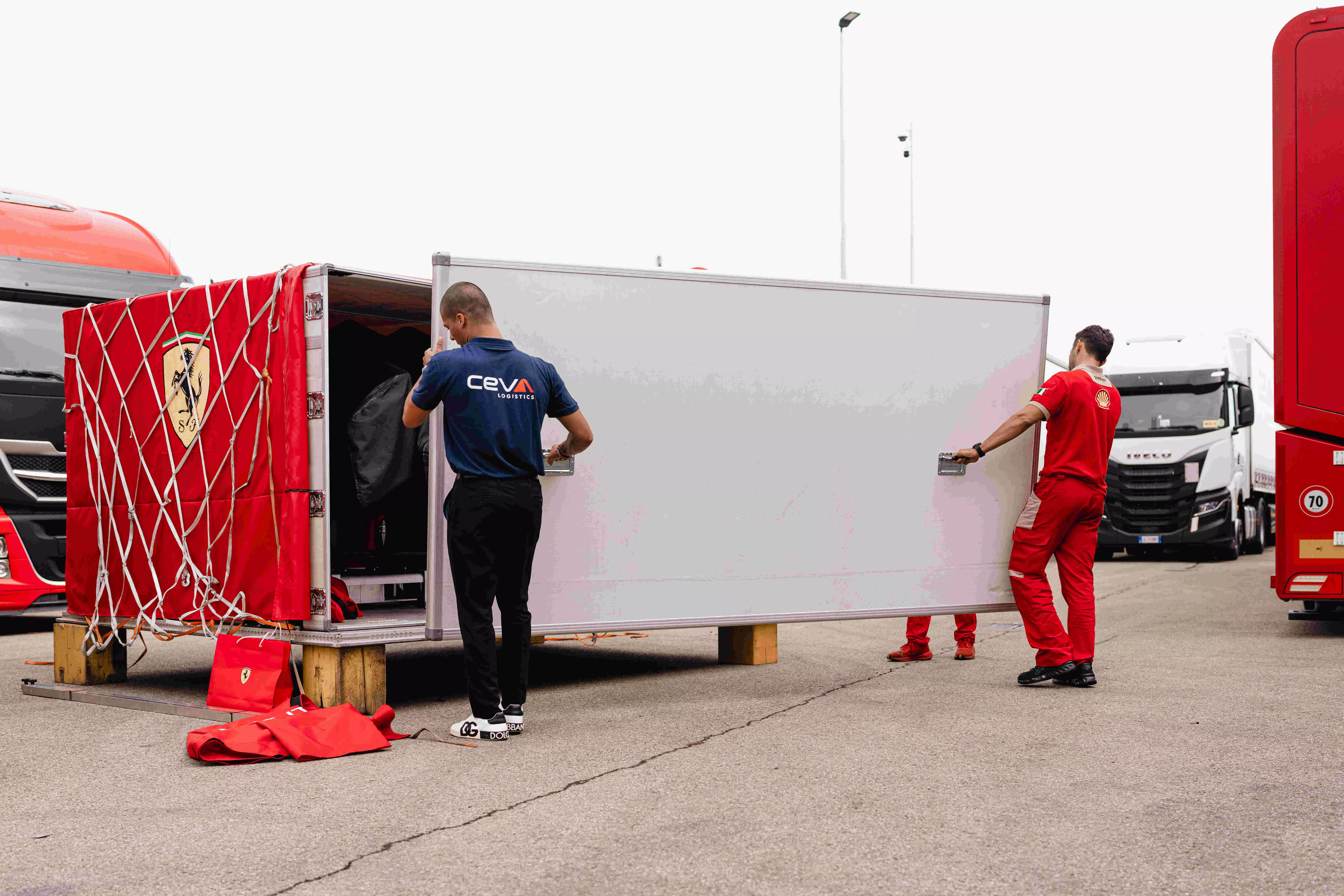 CEVA and Ferrari staff load vital F1 gear for the next Grand Prix.