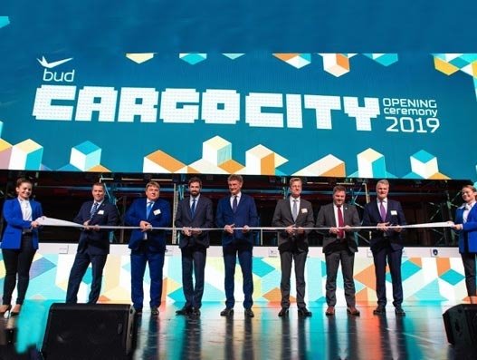 (L-R) Csaba Szlahó, mayor of Vecsés; Sz?cs Lajos, member of the National Assembly of Hungary; Levente Magyar, Parliamentary under secretary of state; Dr Rolf Schnitzler, chief executive officer, Budapest Airport; Gerhard Schroeder, chairman, Budapest Airport; Steven Polmans, chairman, TIACA; and René Droese, chief property and cargo officer, Budapest Airport Air Cargo